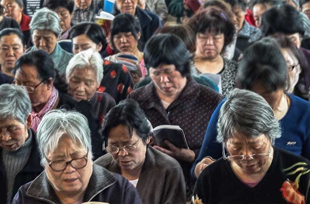 Chinese christians read their bibles and worship together