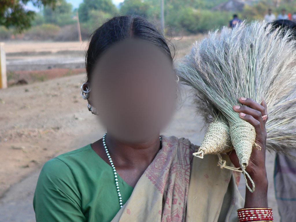 Idian woman holding crops