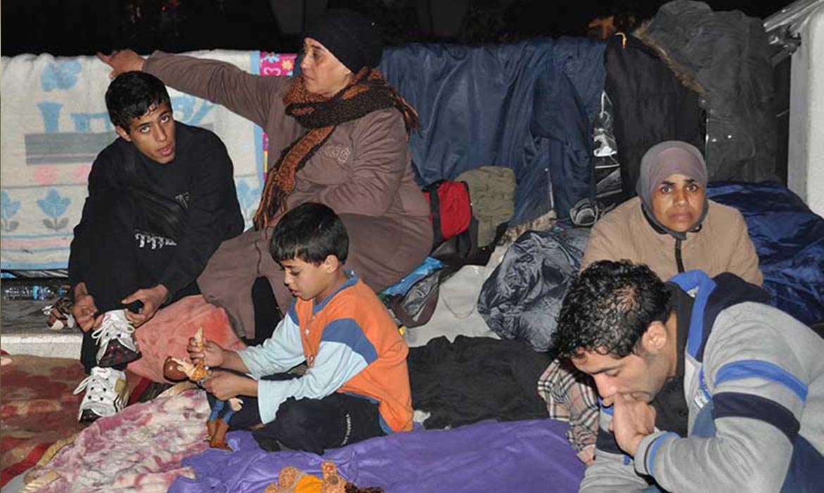 Muslim refugees in a tent with blankets in Greece
