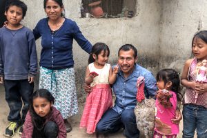 Mexican family in their home made from concrete