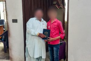 Pakistani christian receives bible from local missionary