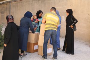 Lebanese Christian missionary delivers aid in cardboard boxes to Lebanese women