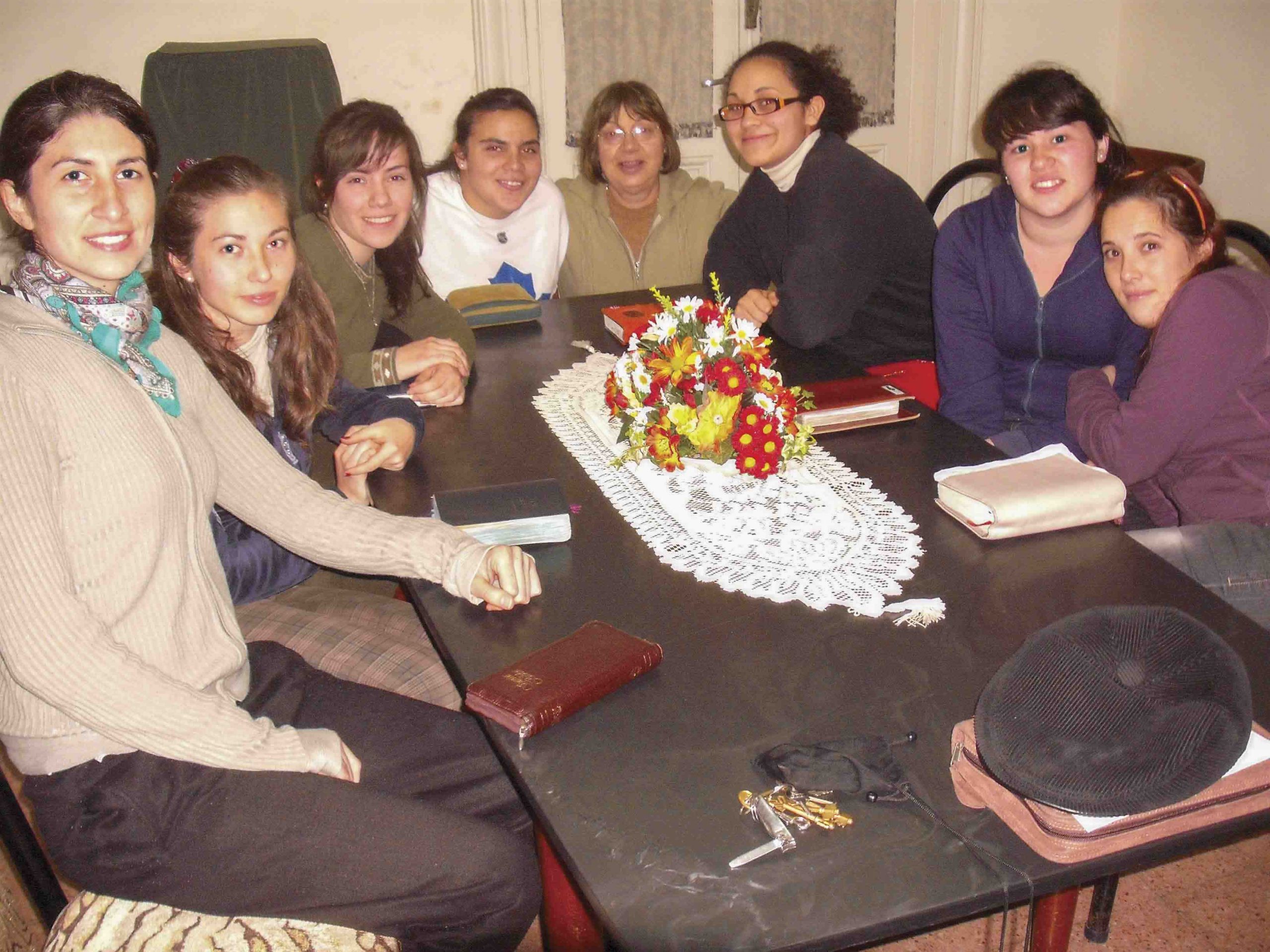 Young women sitting at a table for a Bible study in Uruguay